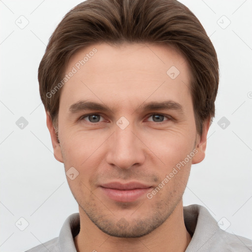 Joyful white young-adult male with short  brown hair and grey eyes