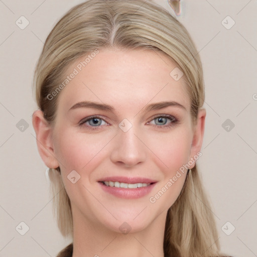 Joyful white young-adult female with long  brown hair and blue eyes