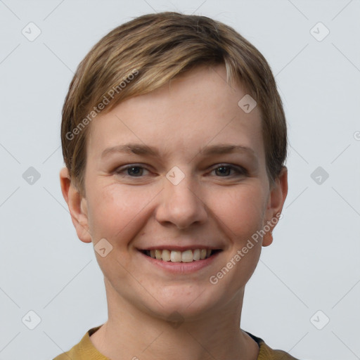 Joyful white young-adult female with short  brown hair and grey eyes