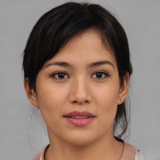 Joyful asian young-adult female with medium  brown hair and brown eyes