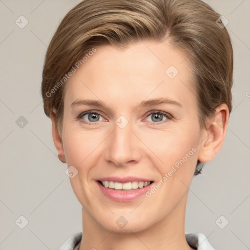 Joyful white young-adult female with short  brown hair and grey eyes