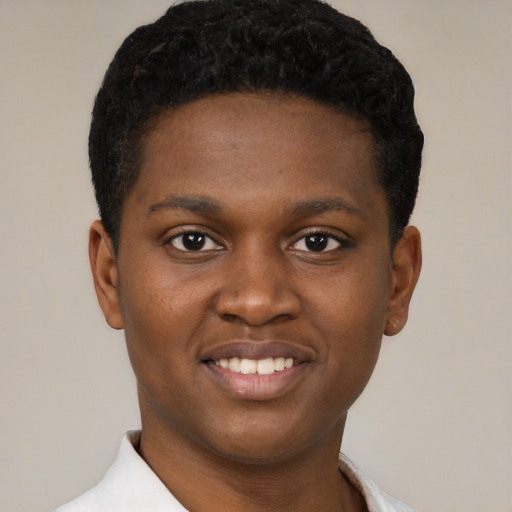 Joyful black young-adult male with short  brown hair and brown eyes