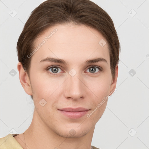 Joyful white young-adult female with short  brown hair and grey eyes