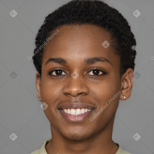 Joyful black young-adult female with short  black hair and brown eyes