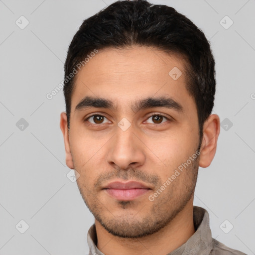 Neutral latino young-adult male with short  black hair and brown eyes