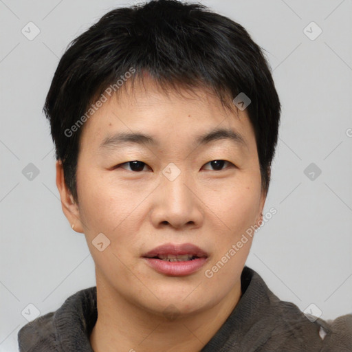 Joyful asian young-adult male with short  brown hair and brown eyes