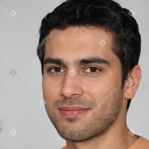 Joyful white young-adult male with short  black hair and brown eyes