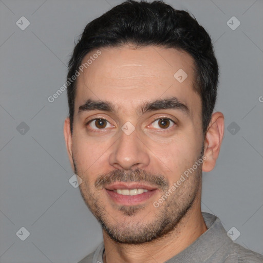 Joyful white young-adult male with short  black hair and brown eyes