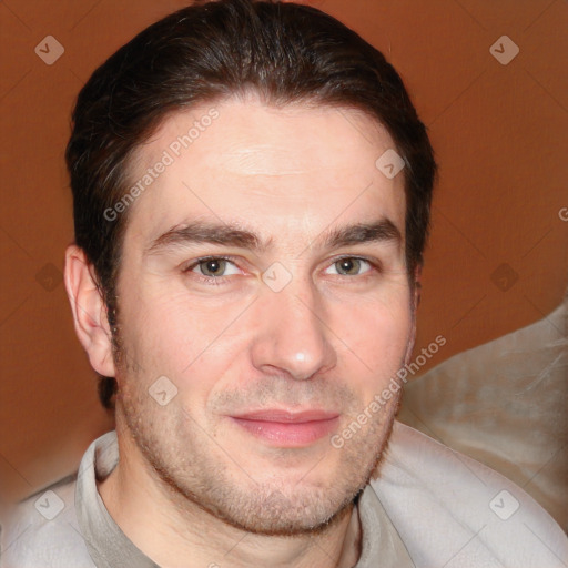 Joyful white adult male with short  brown hair and brown eyes