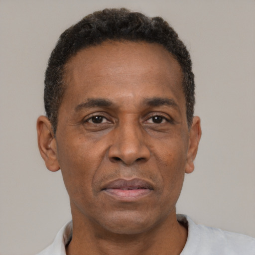 Neutral latino adult male with short  black hair and brown eyes