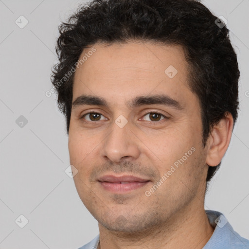 Joyful white young-adult male with short  black hair and brown eyes