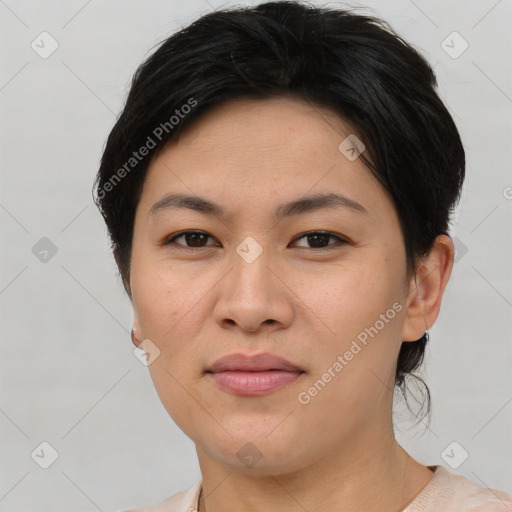 Joyful asian young-adult female with short  brown hair and brown eyes