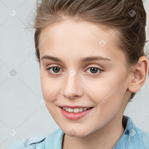 Joyful white child female with medium  brown hair and brown eyes