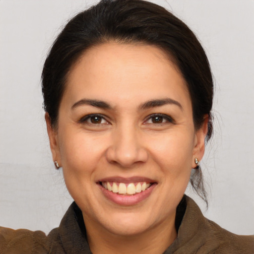 Joyful white young-adult female with medium  brown hair and brown eyes