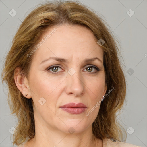 Joyful white adult female with medium  brown hair and grey eyes