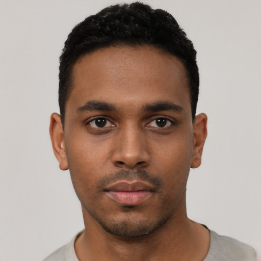 Neutral latino young-adult male with short  black hair and brown eyes