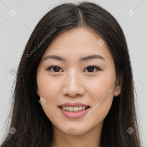 Joyful asian young-adult female with long  brown hair and brown eyes