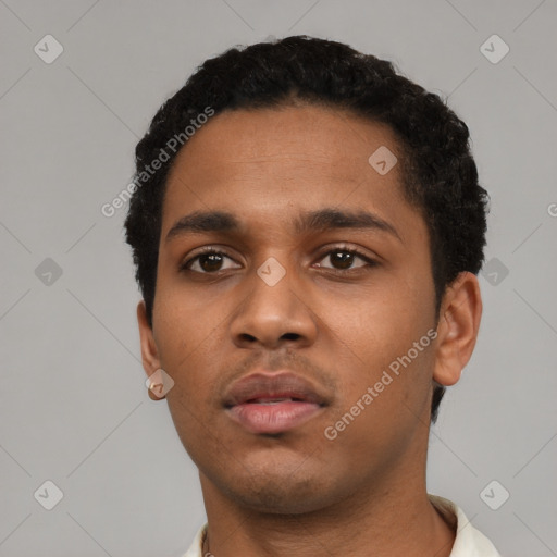 Neutral latino young-adult male with short  black hair and brown eyes