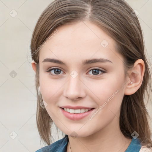 Joyful white young-adult female with medium  brown hair and blue eyes