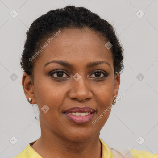 Joyful black young-adult female with short  brown hair and brown eyes