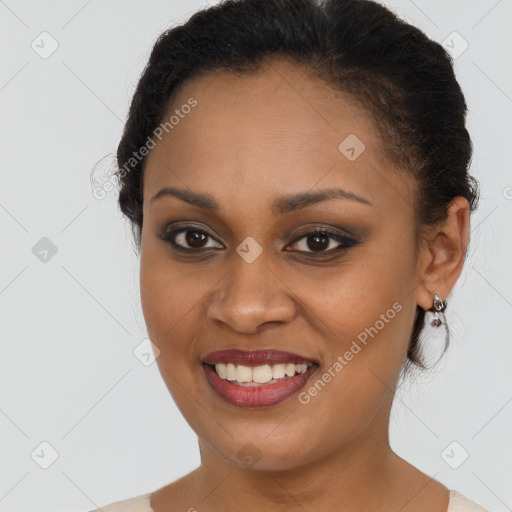 Joyful black young-adult female with short  brown hair and brown eyes