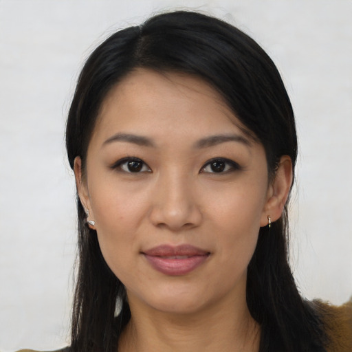 Joyful asian young-adult female with long  black hair and brown eyes