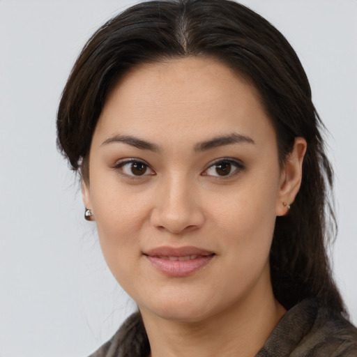 Joyful white young-adult female with medium  brown hair and brown eyes