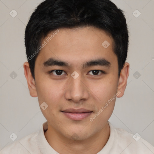 Joyful asian young-adult male with short  brown hair and brown eyes