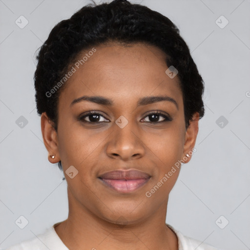 Joyful black young-adult female with short  black hair and brown eyes