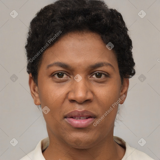 Joyful black adult female with short  brown hair and brown eyes