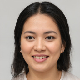 Joyful asian young-adult female with medium  brown hair and brown eyes