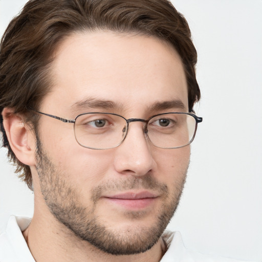 Joyful white adult male with short  brown hair and grey eyes