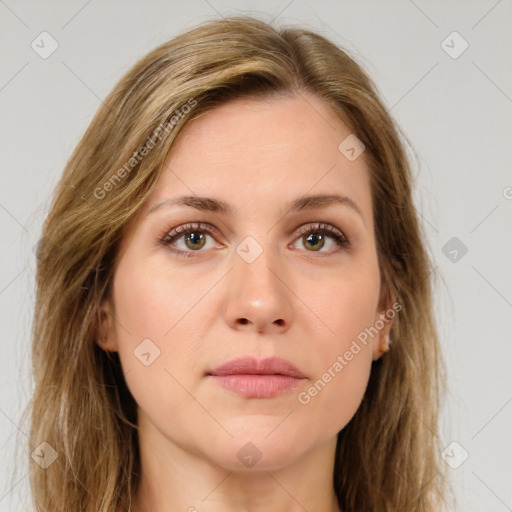 Joyful white young-adult female with long  brown hair and green eyes