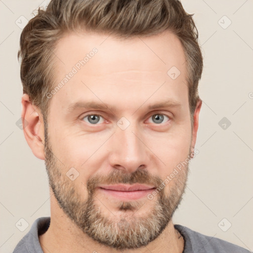 Joyful white adult male with short  brown hair and grey eyes