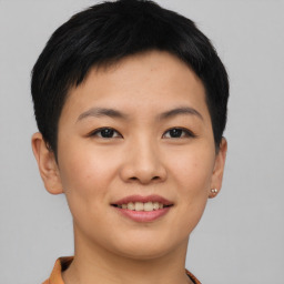 Joyful asian young-adult female with short  brown hair and brown eyes