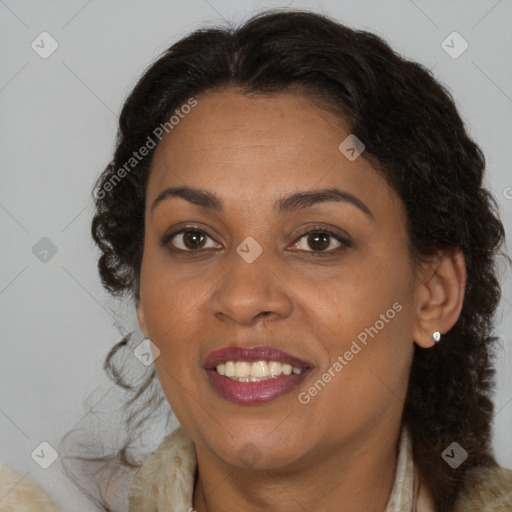 Joyful black adult female with medium  brown hair and brown eyes