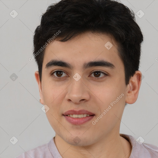 Joyful asian young-adult male with short  brown hair and brown eyes