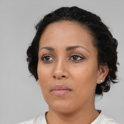 Neutral latino young-adult female with medium  black hair and brown eyes