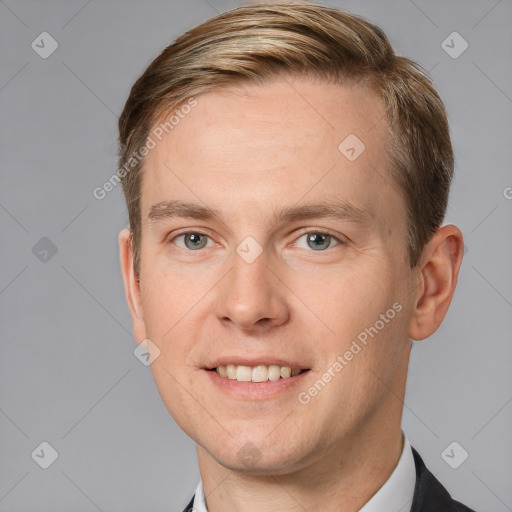 Joyful white adult male with short  brown hair and grey eyes