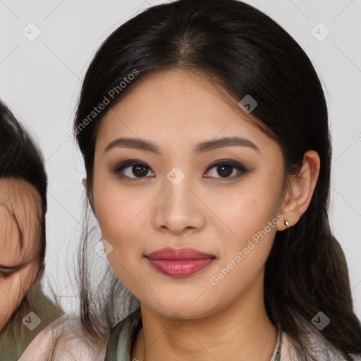 Joyful asian young-adult female with medium  brown hair and brown eyes