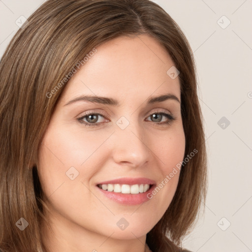 Joyful white young-adult female with long  brown hair and brown eyes