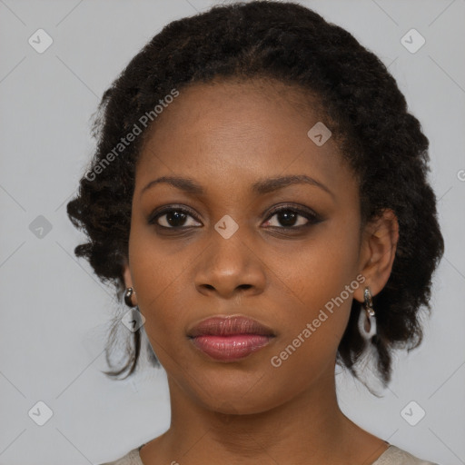 Joyful black young-adult female with medium  black hair and brown eyes