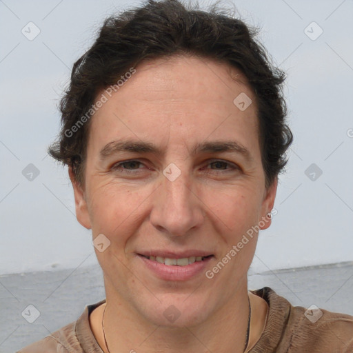 Joyful white adult female with short  brown hair and brown eyes