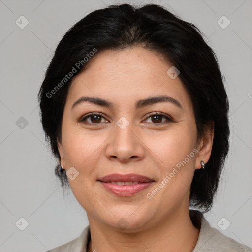 Joyful asian adult female with medium  brown hair and brown eyes