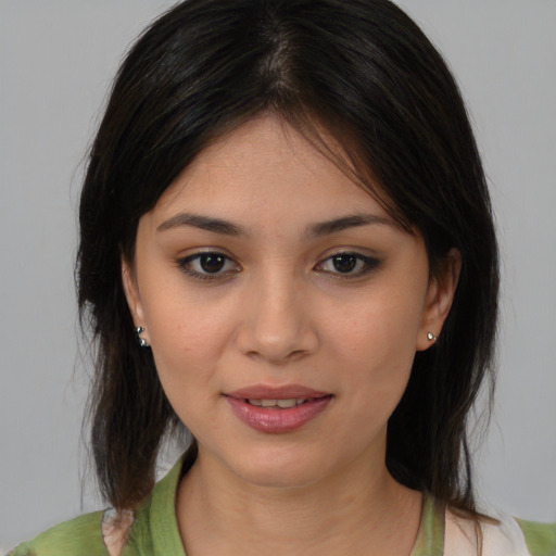 Joyful asian young-adult female with medium  brown hair and brown eyes