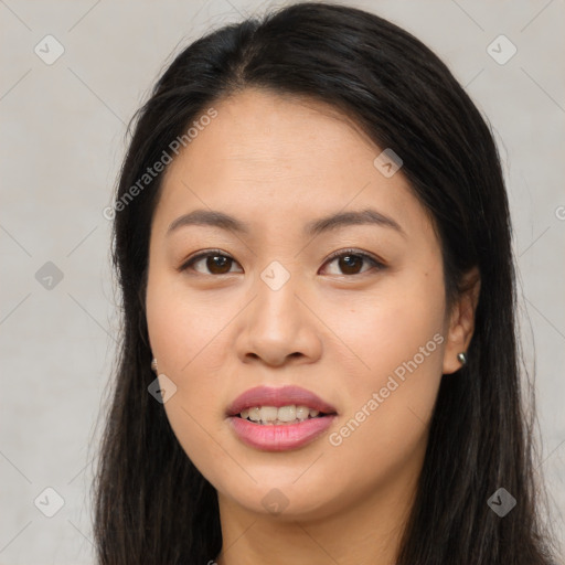 Joyful asian young-adult female with long  brown hair and brown eyes