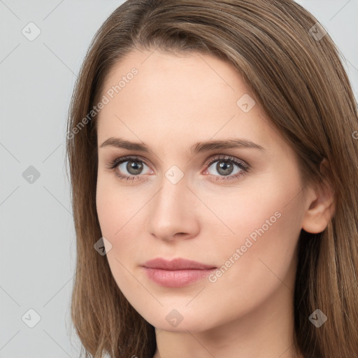 Neutral white young-adult female with long  brown hair and brown eyes