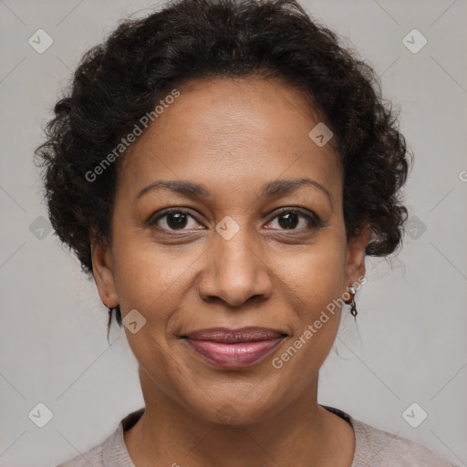 Joyful black adult female with short  brown hair and brown eyes