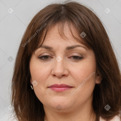 Joyful white adult female with medium  brown hair and brown eyes