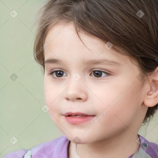 Joyful white child female with short  brown hair and brown eyes